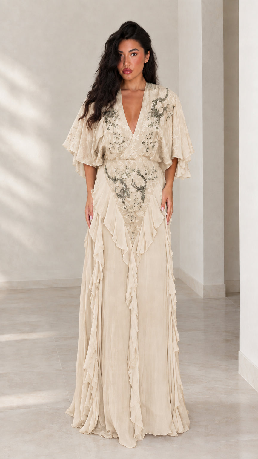 Front view of champagne beige embroidered V-neck formal maxi dress