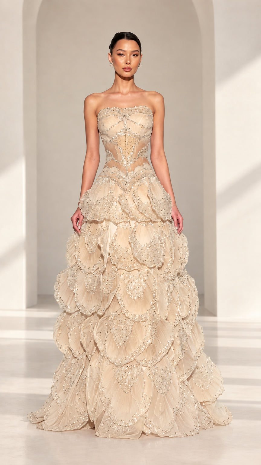 Front view of strapless beaded corset petal evening gown in Champagne