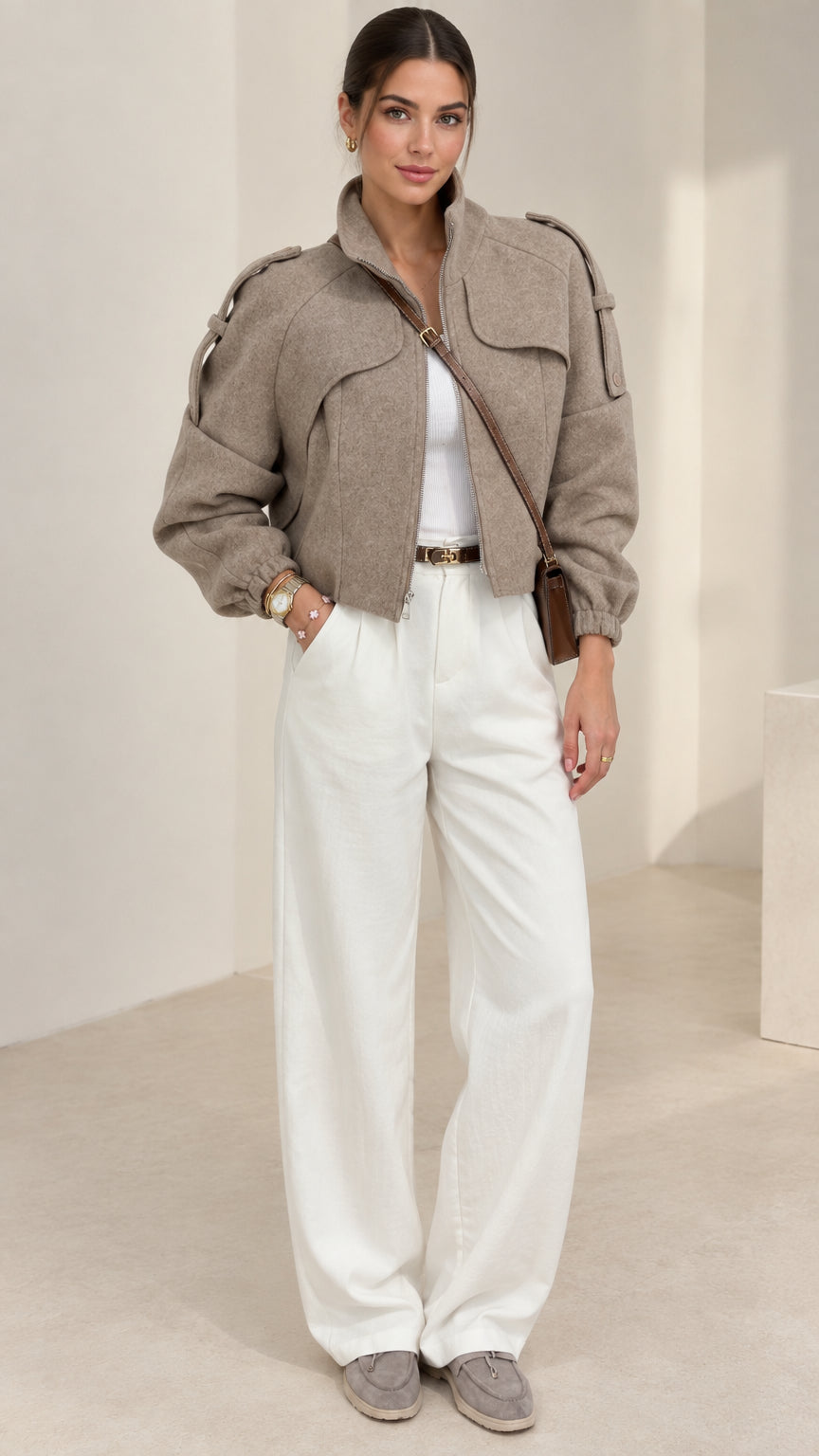 Taupe cropped stand collar utility jacket front view on model with white wide-leg trousers