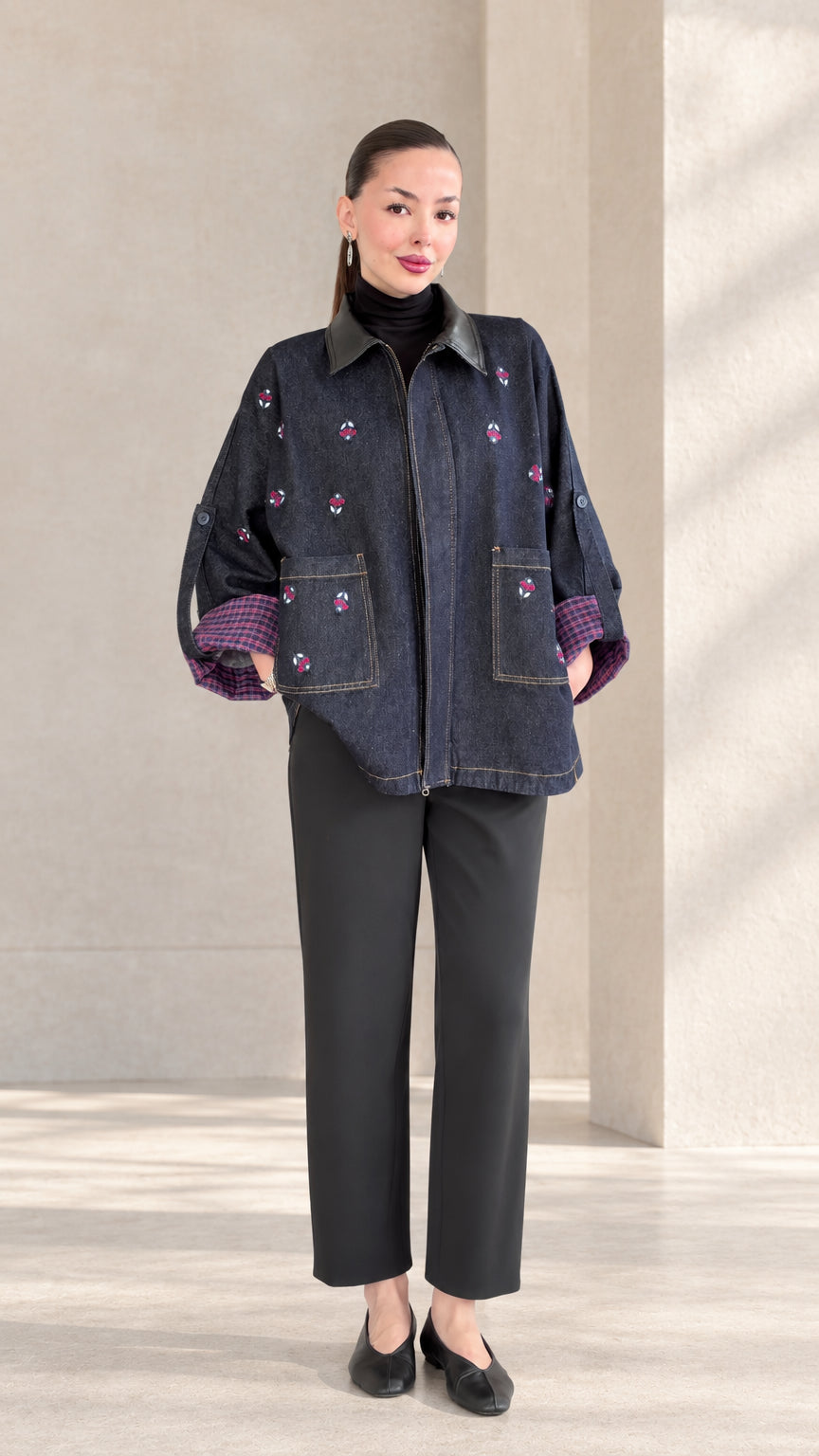 Front view of woman wearing Indigo Blue floral embroidered zip-up jacket with faux leather collar