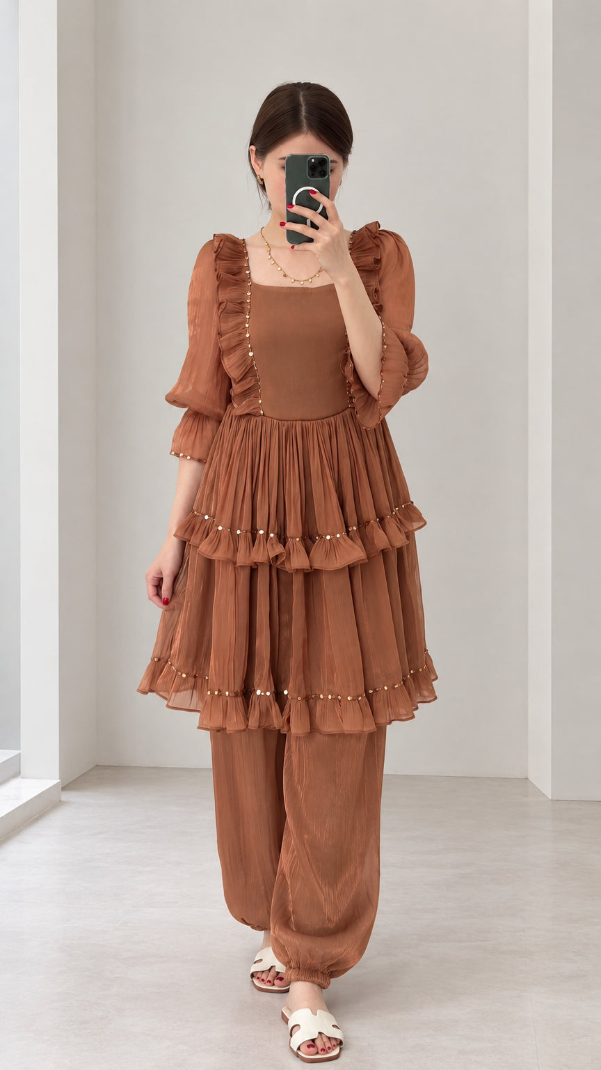 Front view of woman wearing Rust Brown tiered ruffle tunic and harem pant two-piece set