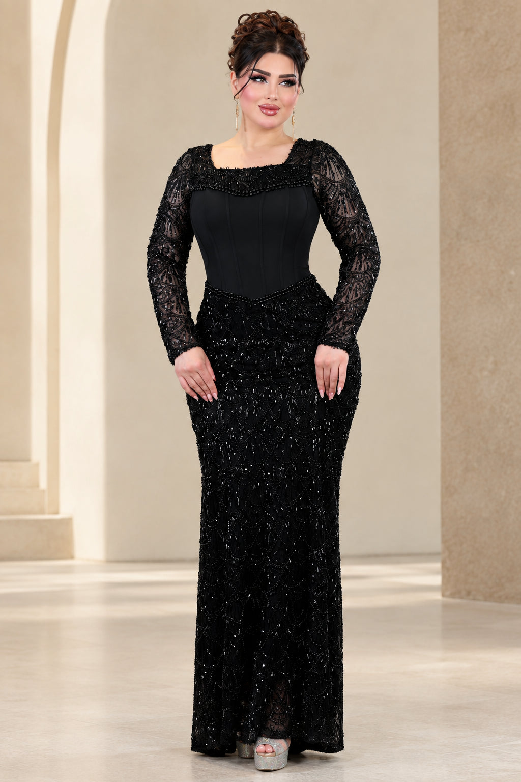 Front full view of black beaded long sleeve corset evening maxi gown