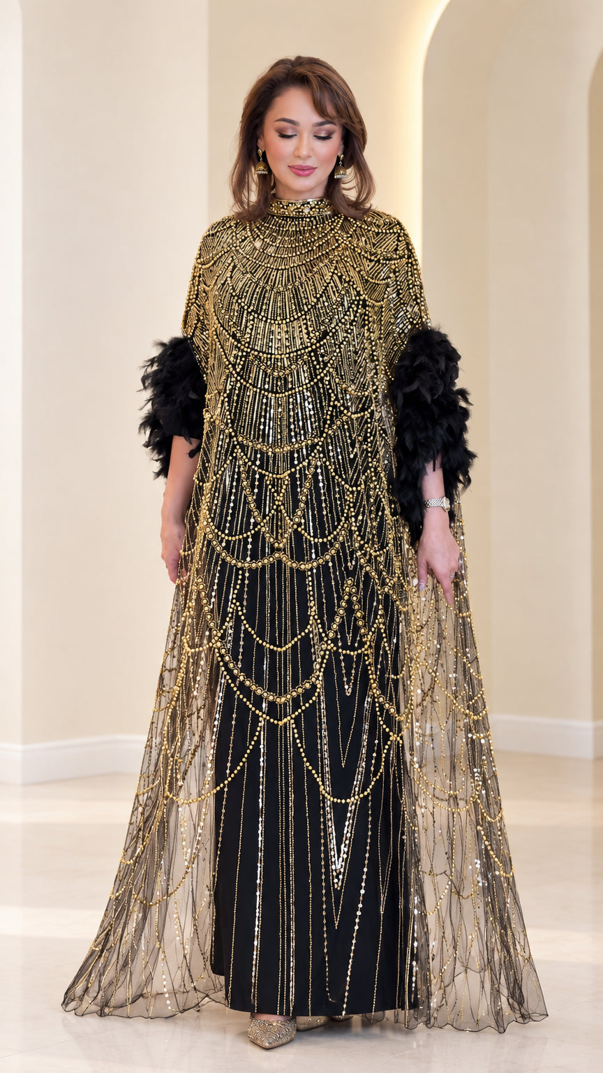 Front view of black beaded cape evening maxi gown with feather cuffs