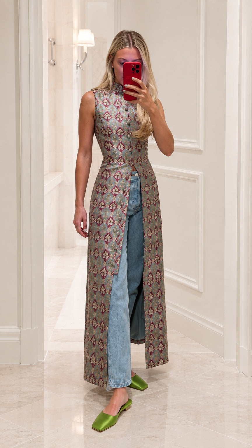 Model wearing sage green jacquard mandarin collar maxi tunic with front slit and denim