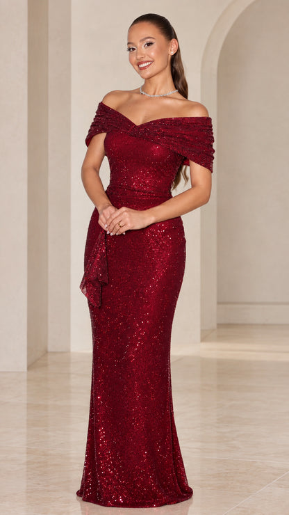 Front view of model wearing burgundy off-the-shoulder sequin floor-length evening gown