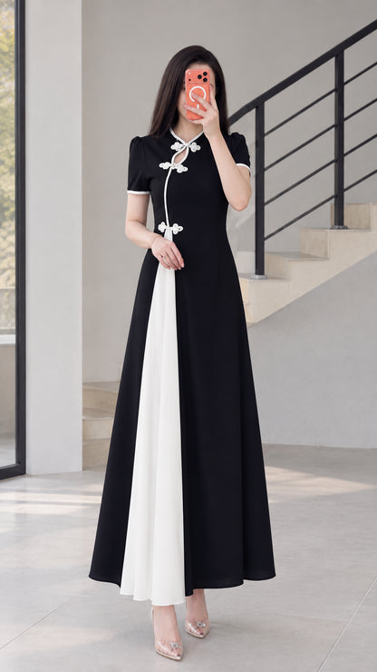Full front view of black modern cheongsam maxi dress with white contrast panel