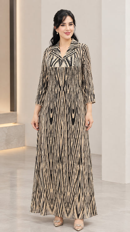 Women's long sleeve sequin-accented printed maxi dress in champagne gold front view