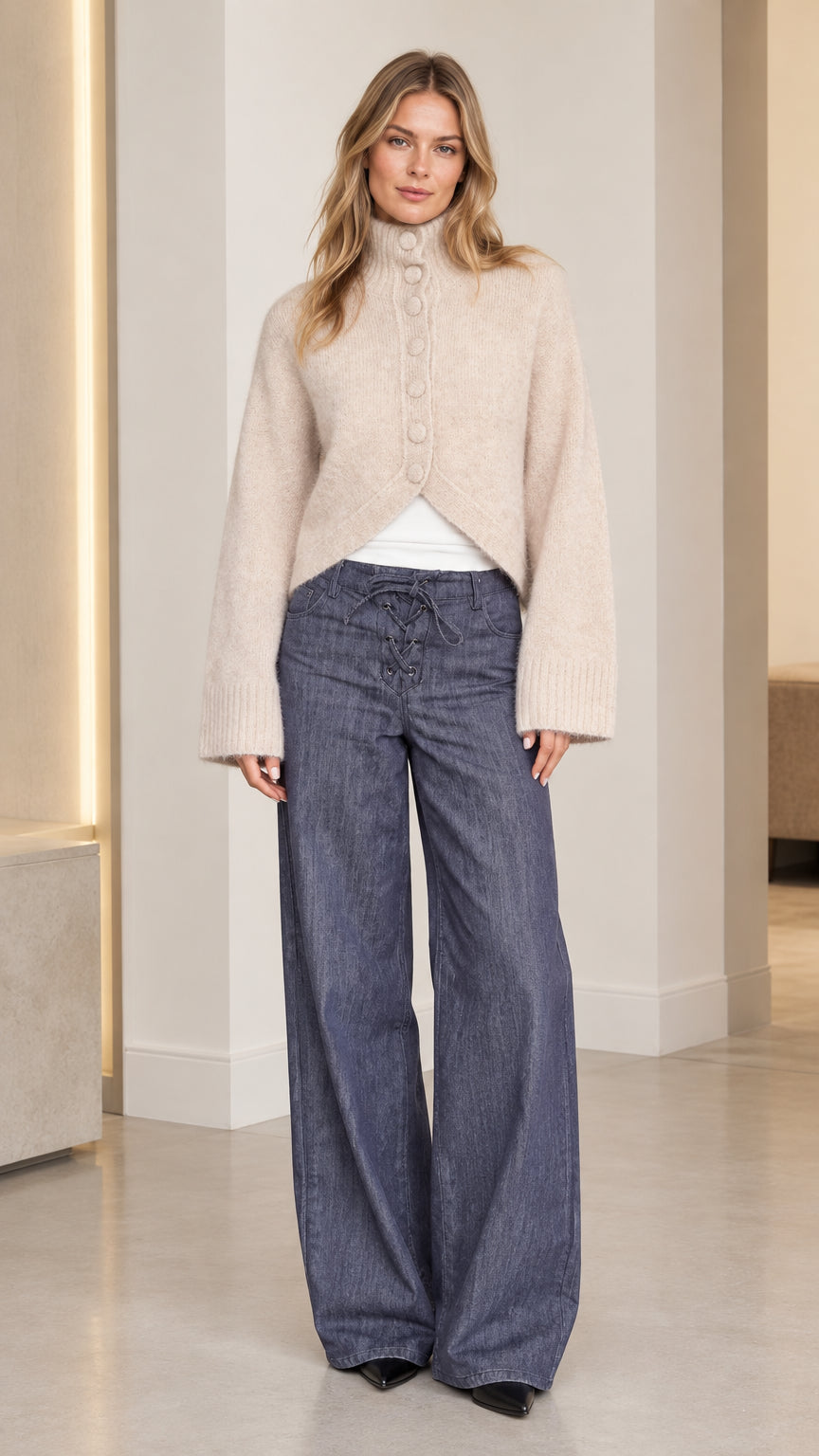 Women's beige high neck fuzzy knit cardigan front view with cutaway hem and wide leg pants