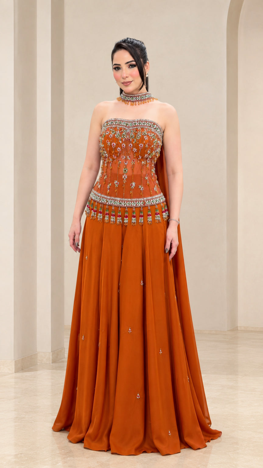 Rust orange strapless evening gown with beaded embroidery and flowy skirt - front view