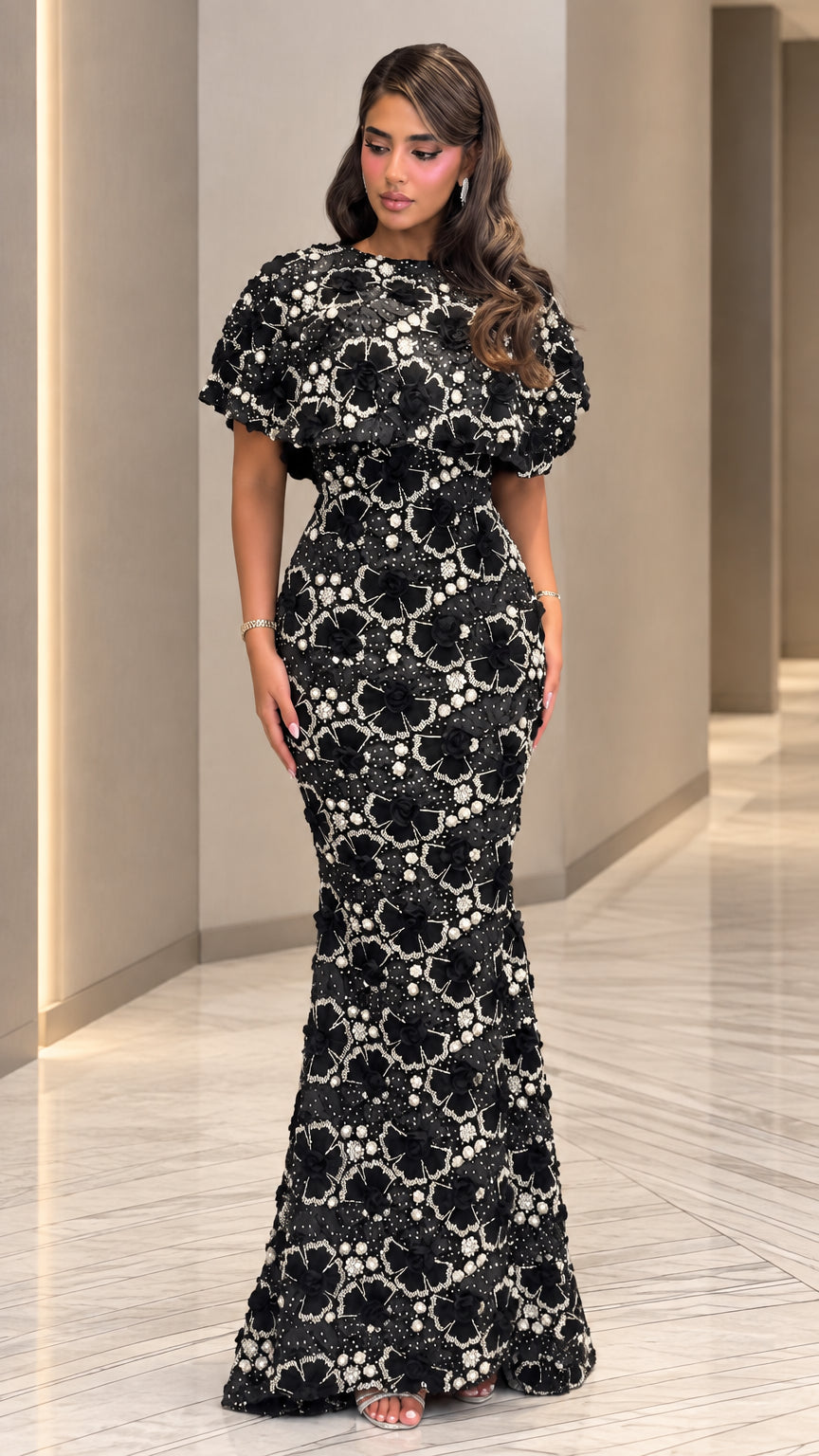 Full front view of model wearing black 3D floral appliqué beaded mermaid evening gown