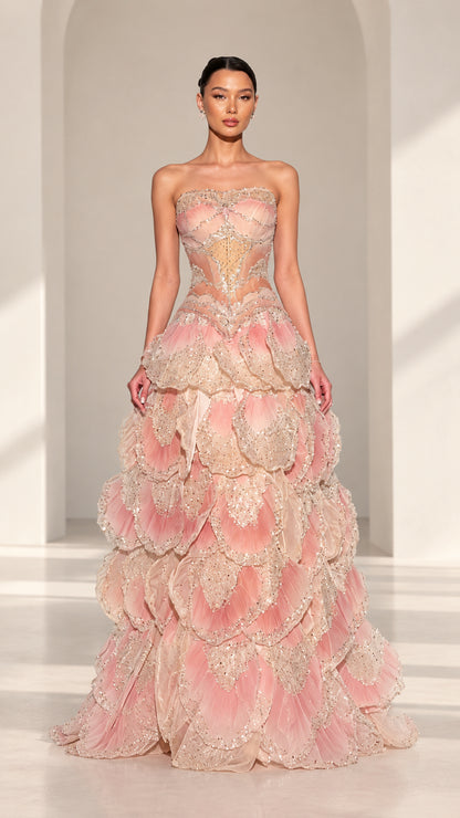 Front full view of Blush Pink strapless beaded corset evening gown with petal tiered skirt