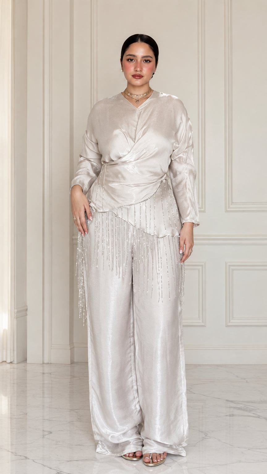 Front full view of Champagne satin draped wrap top with beaded fringe and wide-leg trousers