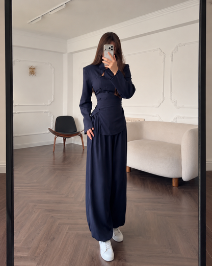 Front view of a navy two-piece set with fitted mandarin collar top and wide leg pants