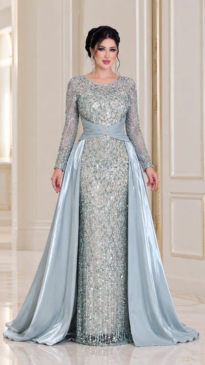 Ice blue long sleeve sequined evening gown with satin overskirt front view