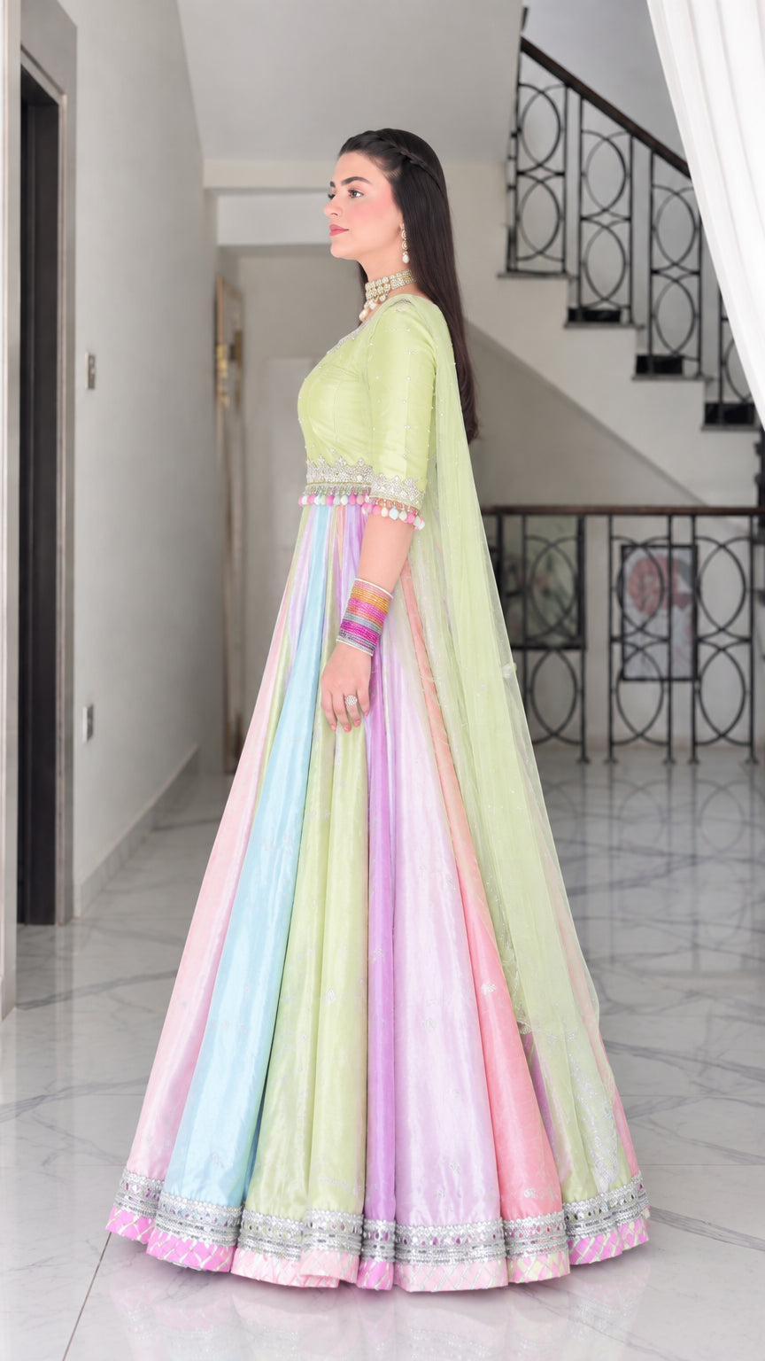 Side profile of lime green pastel paneled festive maxi gown with dupatta