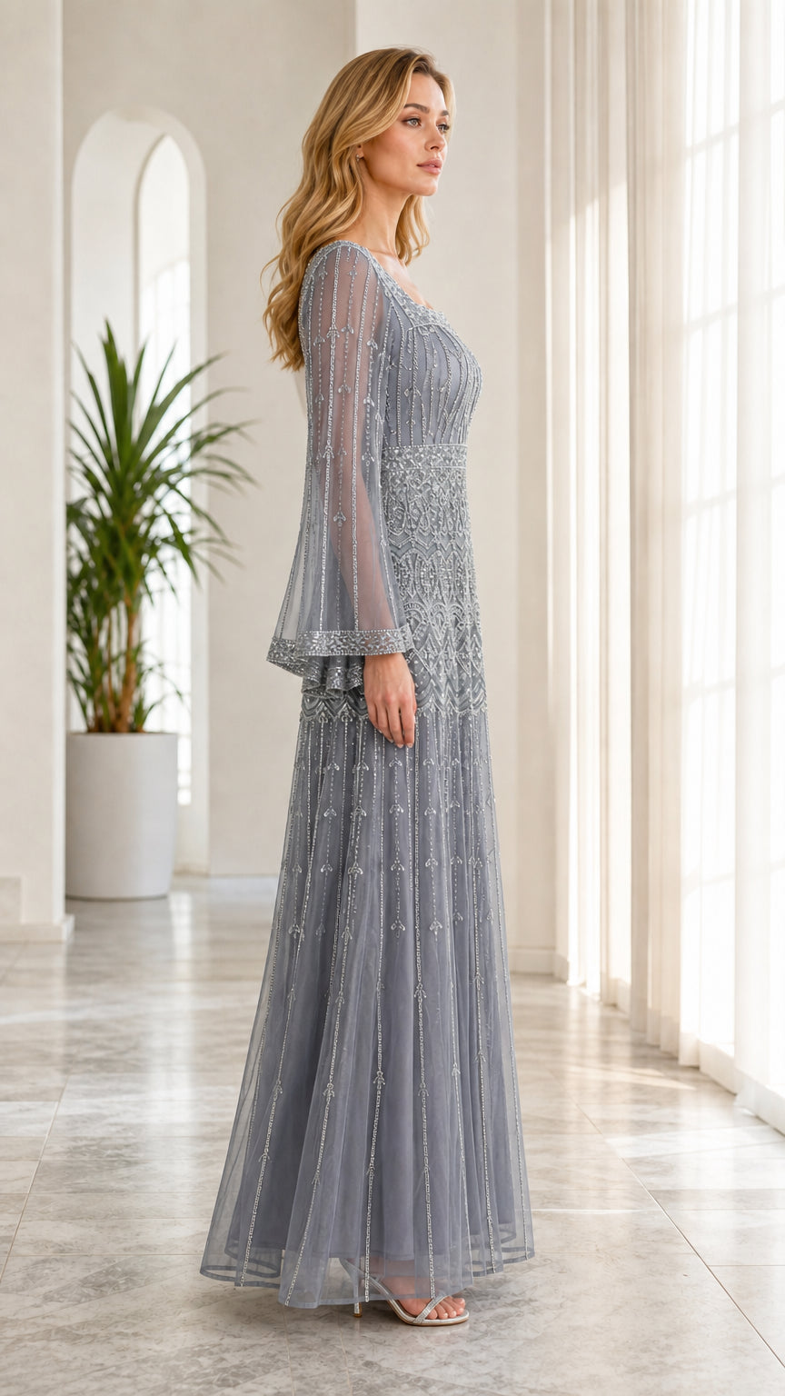 Side full-length view of model wearing dusty blue embellished formal maxi dress