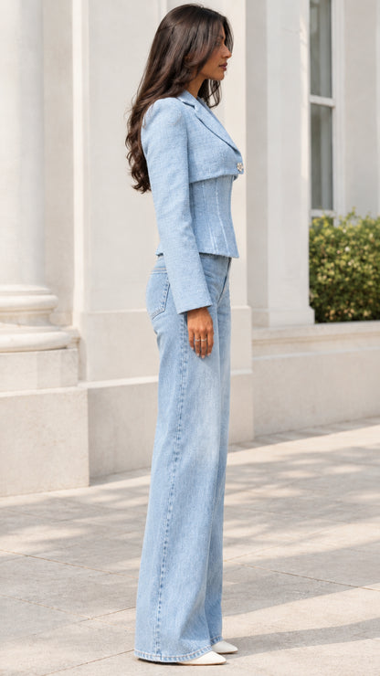 Side profile of model wearing Light Blue tailored corset tweed jacket