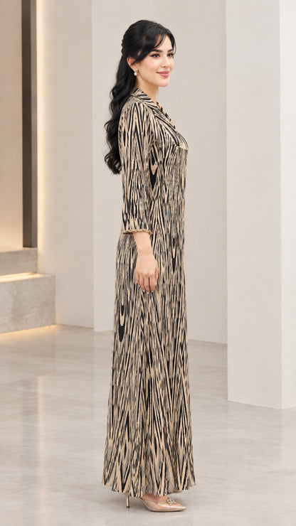 Side profile of champagne gold printed long sleeve maxi dress