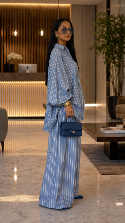 Side view of dusty blue striped two-piece set with flowing sleeves