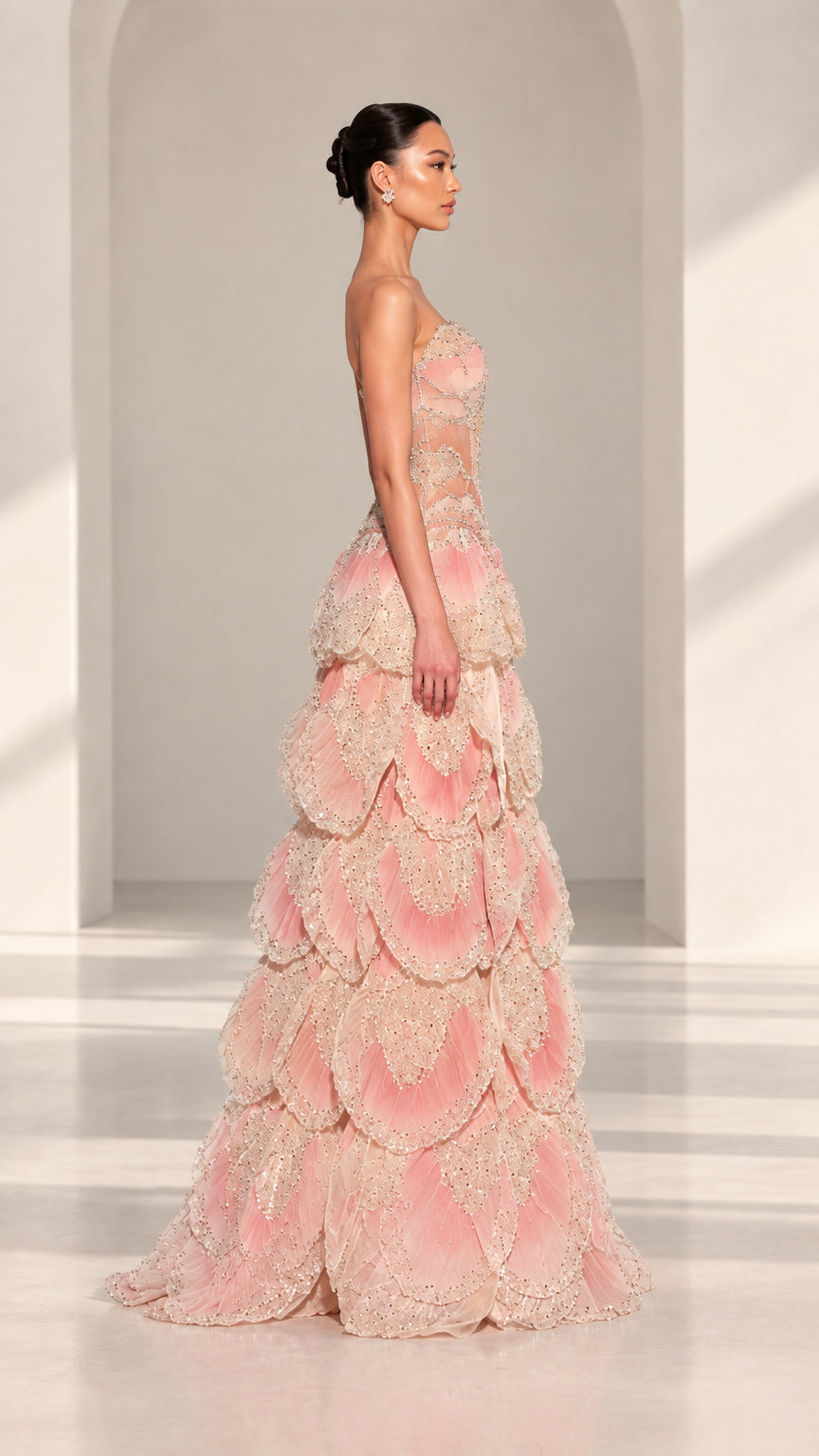 Side profile view of Blush Pink strapless formal gown showing voluminous tiered skirt