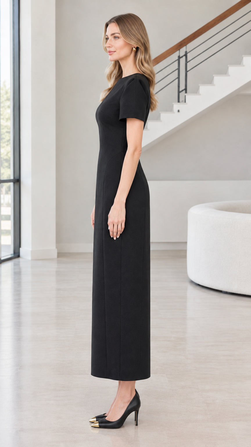 Side view of woman wearing Black short sleeve column maxi dress