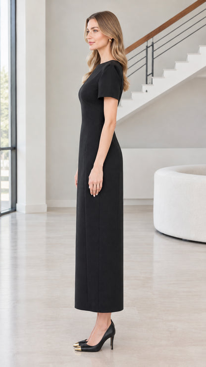 Side view of woman wearing Black short sleeve column maxi dress
