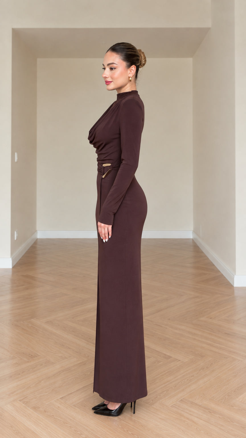 Side profile of model in chocolate brown long sleeve column maxi dress