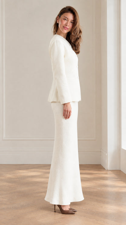 Side profile view of women's ivory tailored two-piece skirt suit set