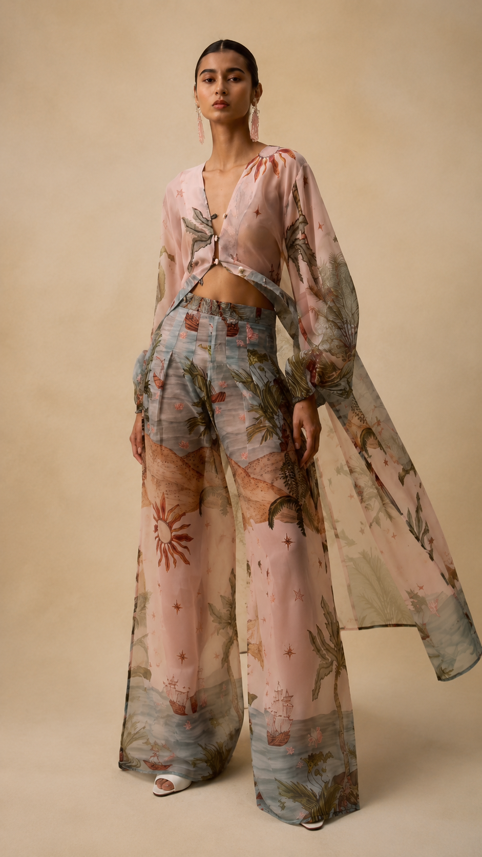 Full-length blush pink printed wide-leg pants set with long sheer overlay and billowy sleeves