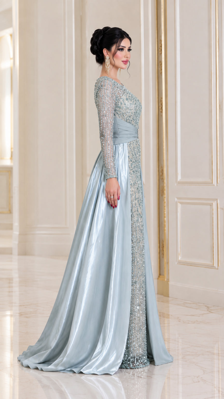Side profile of ice blue sequin evening dress with flowing satin skirt