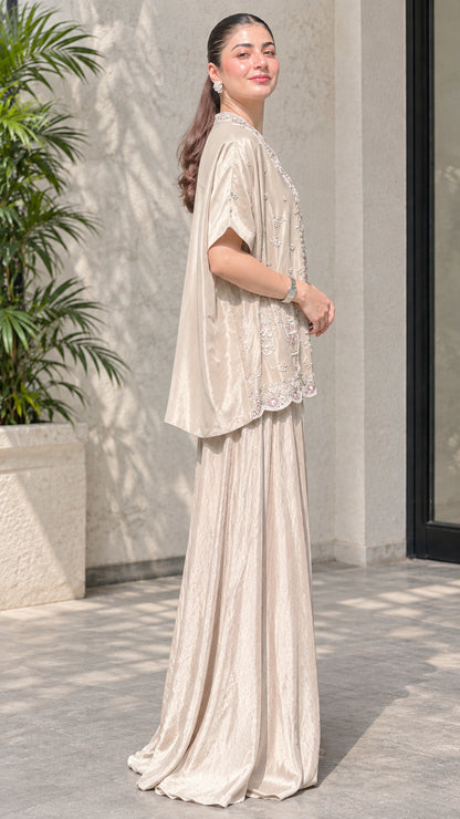 Champagne shimmering pant set side view showing flowy drape