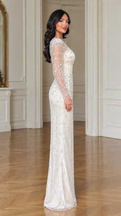 Side profile of model in ivory embellished column formal maxi dress