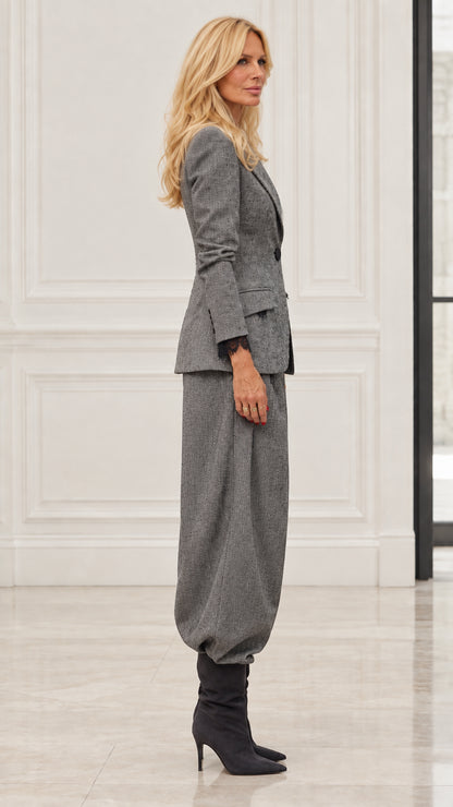Side profile of model in Grey tailored blazer and relaxed balloon pants set