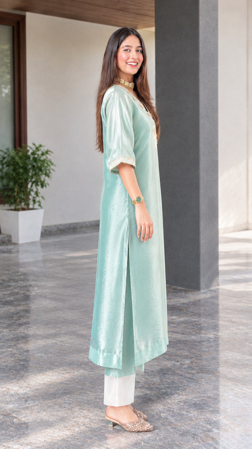 Side profile view showing side slit and drape of sage green silk blend tunic kurta