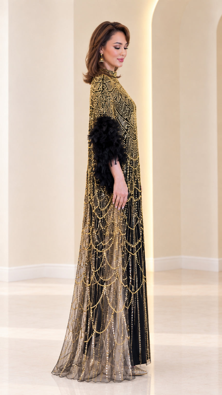 Side profile of woman wearing black and gold beaded cape gown