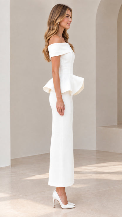 Side profile view of model in white peplum evening column gown