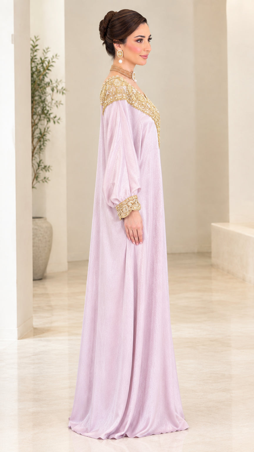 Side view of woman in lilac long sleeve embroidered kaftan gown