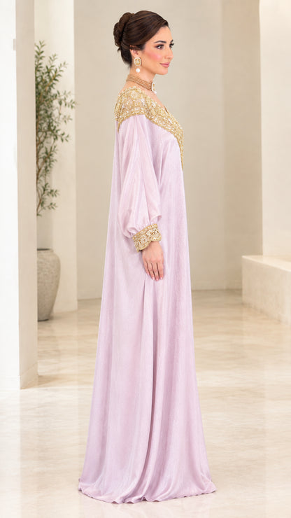 Side view of woman in lilac long sleeve embroidered kaftan gown