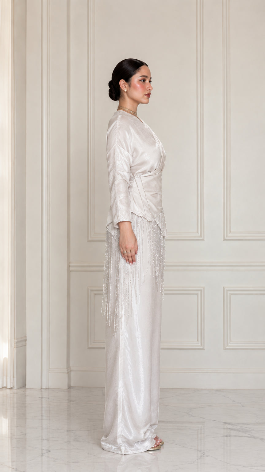 Side full view of model wearing Champagne satin two-piece set