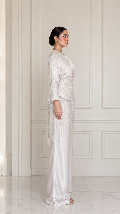 Side full view of model wearing Champagne satin two-piece set
