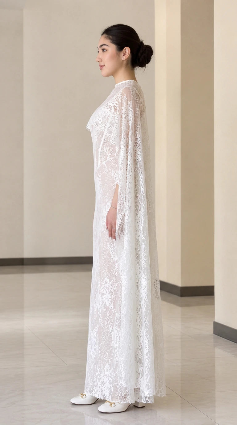 White lace evening gown with cape overlay, side profile view