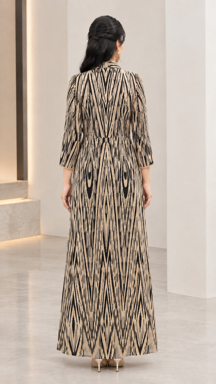 Back view of champagne gold A-line printed maxi dress