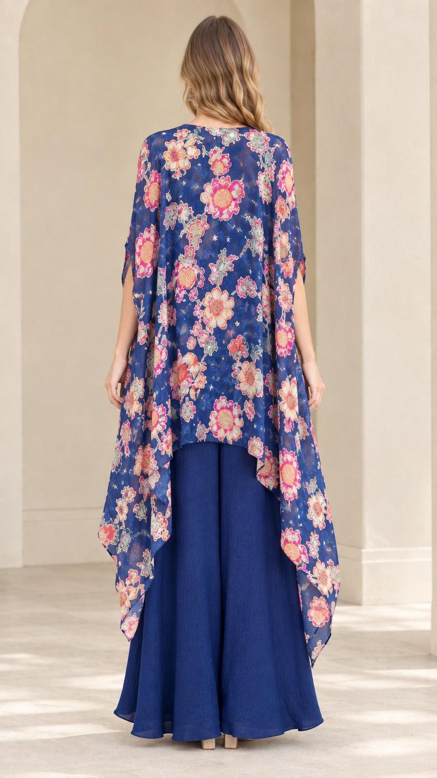 Back view of royal blue sweeping floral duster cape and matching palazzo pants