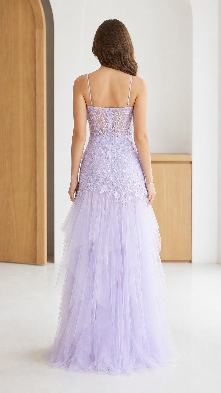 Back view of lavender lace corset evening gown with tiered tulle skirt