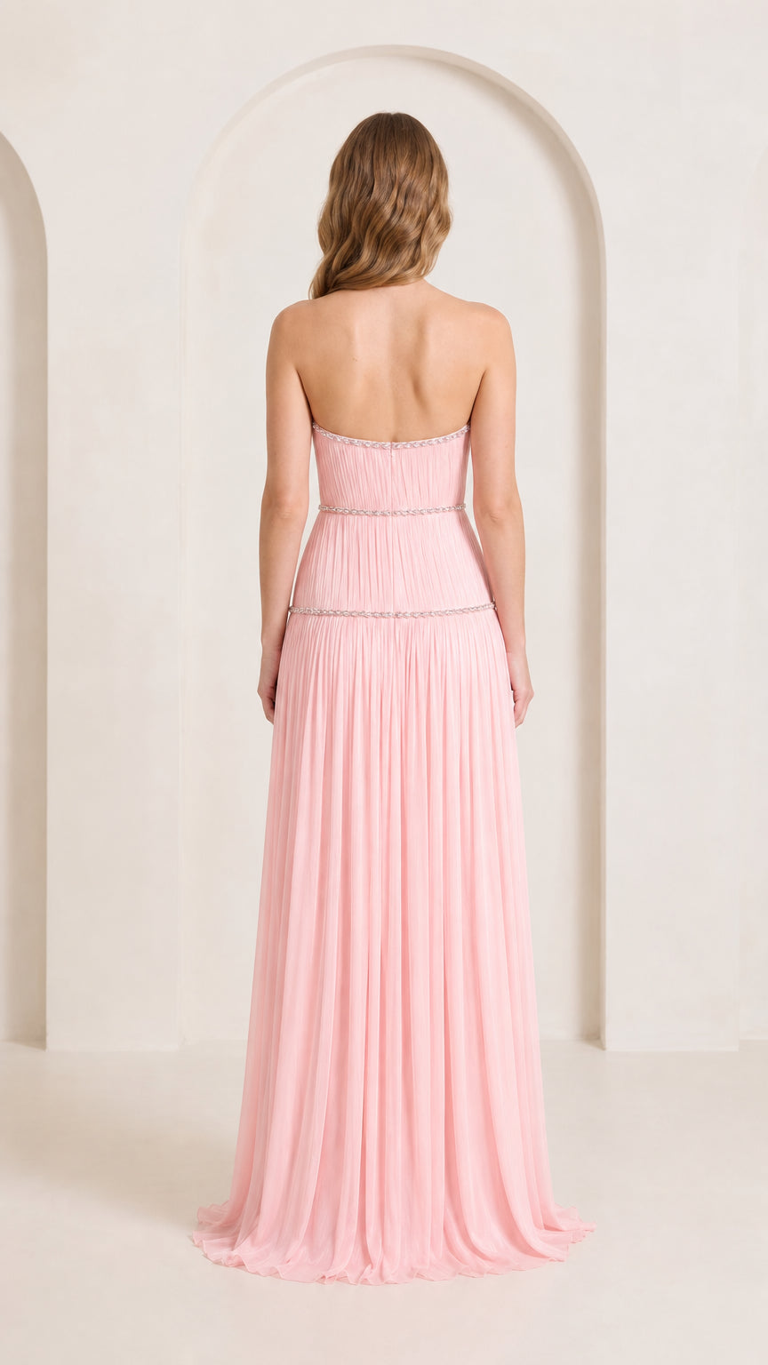 Back view of strapless blush pink evening dress with delicate ruched detailing