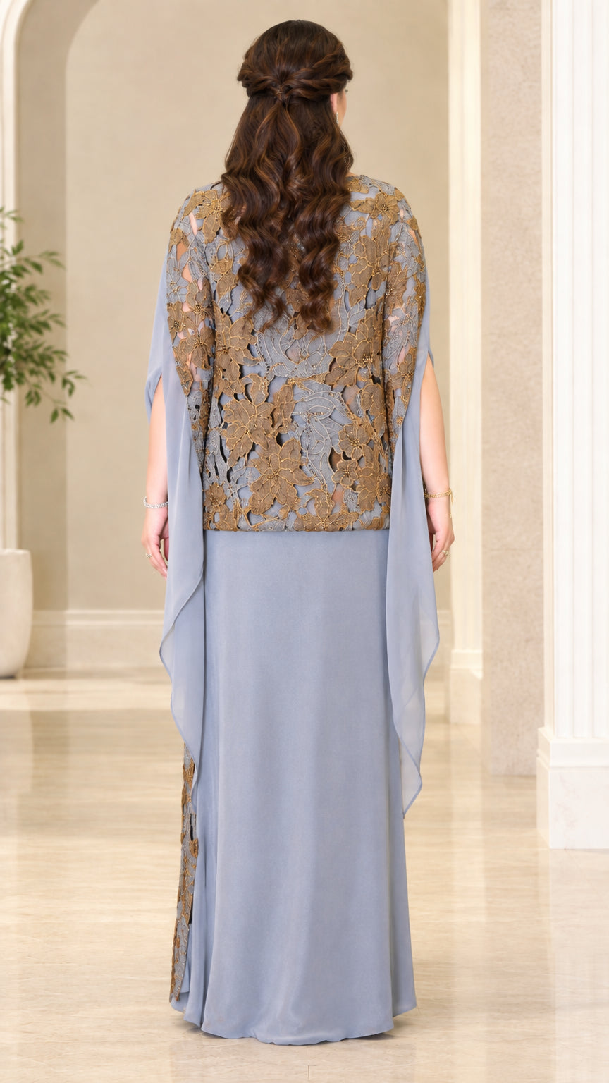 Back view of dusty blue evening maxi gown showing flowing cape detail