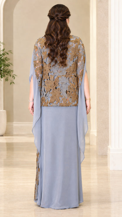 Back view of dusty blue evening maxi gown showing flowing cape detail