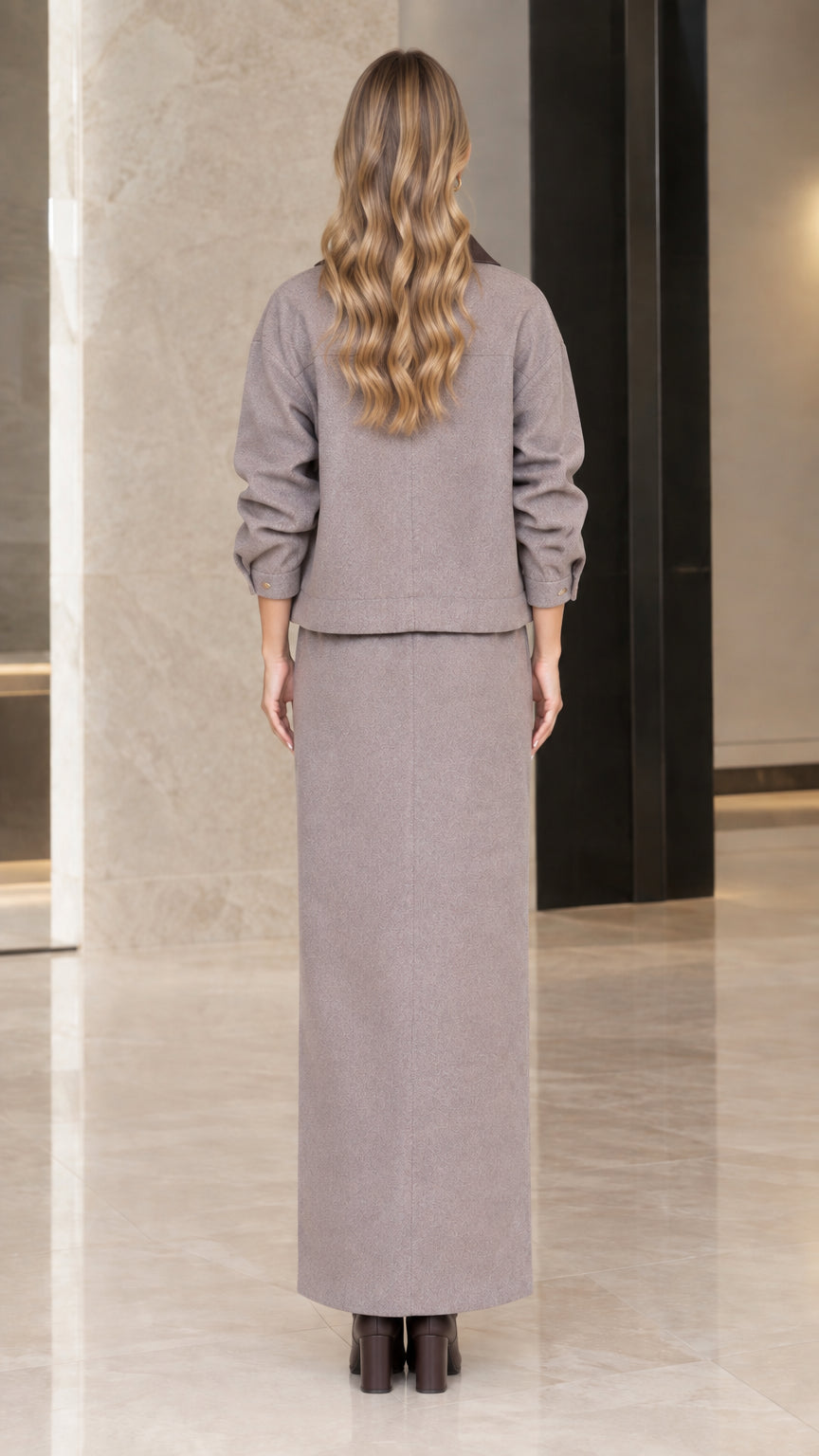 Back view of woman wearing Taupe Gray matching jacket and maxi skirt set