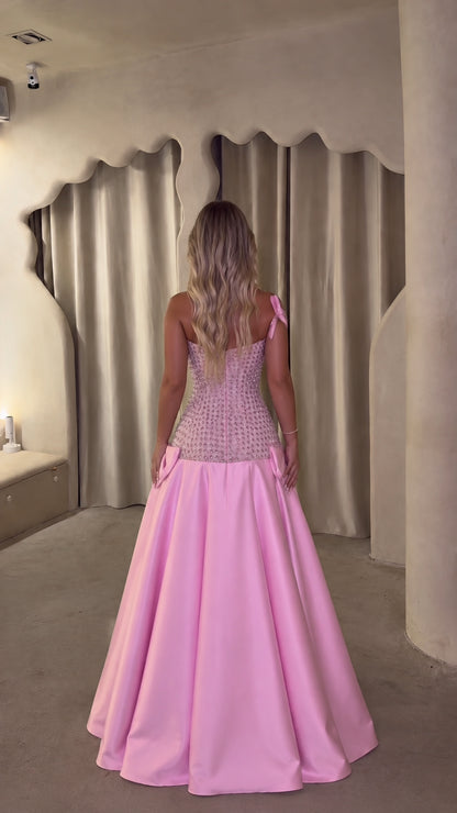 Back view of woman wearing pink sweetheart lace-trim formal gown