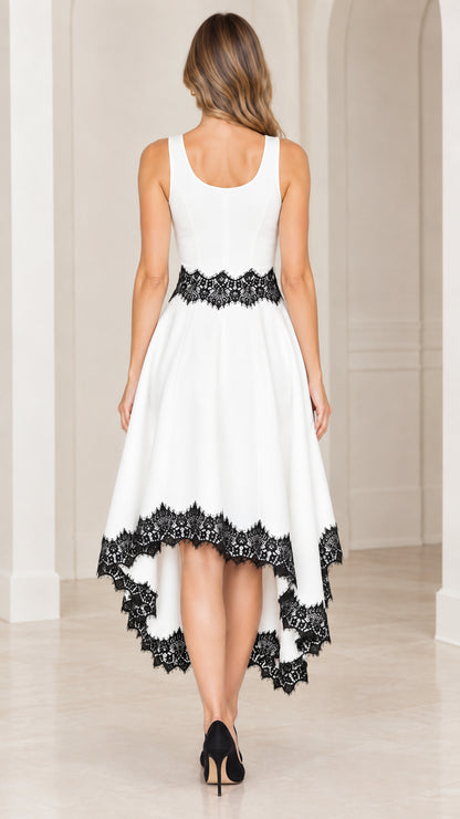 Back view of woman wearing white sleeveless high-low dress with lace waist and hem